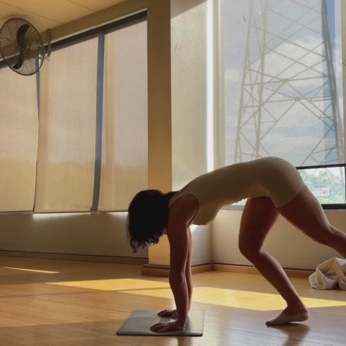 Woman demonstrating Handstand using the Balance Base for wrist support and enhanced balance ability.
